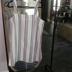 Sun dress made of black, grays and white stripes.